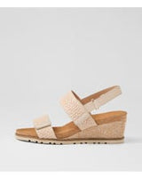 Ziera Kift wedge sandal in natural-toned raffia with adjustable straps, cushioned footbed, and mid-height wedge sole on a white background