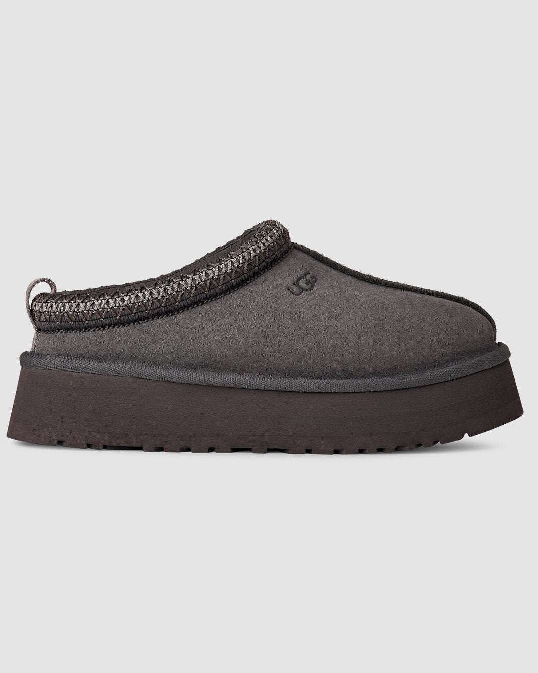 Gray slip-on shoe with a thick sole on a light gray background