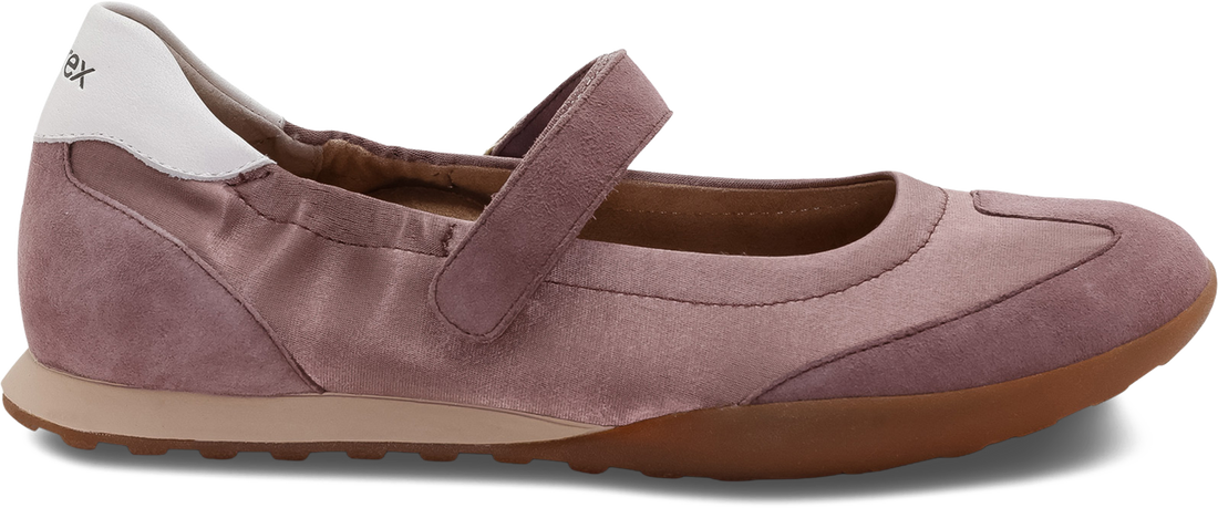 A single Exo brand Mary Jane shoe in a dusty mauve-purple color, featuring a suede-like finish, a hook-and-loop strap, a white heel tab, and a brown sole, shown against a plain white background.