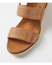 Ziera Kift wedge sandal in coffee-toned raffia with adjustable straps, cushioned footbed, and mid-height wedge sole on a white background