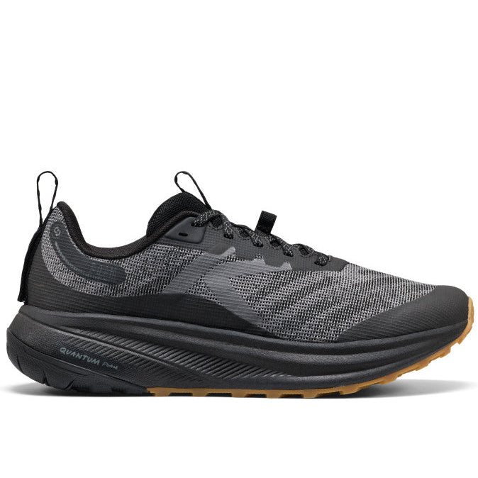 Black running shoe with brown sole on a white background